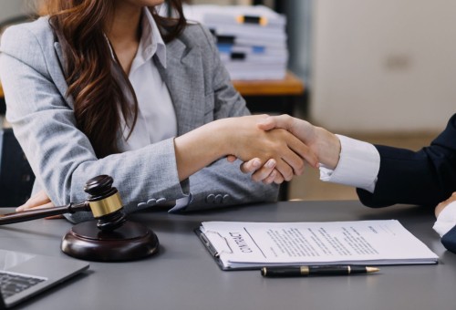 vecteezy_male-lawyer-working-with-contract-papers-and-wooden-gavel-on_16340390_247_web.jpg
